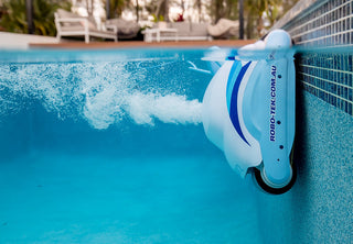 Robo-Tek Robo Plus V2 Robotic Pool Cleaner with Remote & Caddy inside pool wall